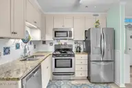 1404 Canal Drive 15, Carolina Beach, NC 28428 — 2-bedroom condo in Ocean Harbor, Carolina Beach, NC, photo 10 of 32: 06-Final 1404 Canal Dr Unit 15-RJREM-216