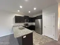 84 Aspen Road, Hampstead, NC 28443 — 3-bedroom townhome in Cypress Grove, Hampstead, NC, photo 5 of 28: Kitchen