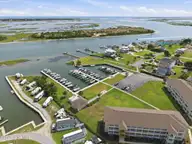 650 Cedar Point Boulevard C21, Cedar Point, NC 28584 — 2-bedroom waterfront condo in Cedar Point Villas, Cedar Point, NC, photo 2 of 30: 18-web-or-mls-DJI_20260715152839_0211_D