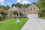 696 Donmovin Court NW, Calabash, NC 28467 — 4-bedroom home in Meadowlands, Calabash, NC, photo 1 of 50