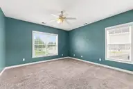 112 White Heron Lane, Swansboro, NC 28584 — 3-bedroom waterfront home in Bluewater Cove, Swansboro, NC, photo 16 of 60: Primary Bedroom