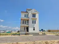 137 Ocean Promenade, Indian Beach, NC 28512 — 5-bedroom waterfront home in The Pearls Oceanside, Indian Beach, NC, photo 1 of 24