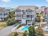 2003 W Pelican Drive, Oak Island, NC 28465 — 4-bedroom waterfront home in W. Long Beach, Oak Island, NC, photo 1 of 65: Ocean views!