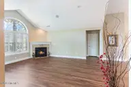 103 E Chelsea Court, Southern Pines, NC 28387 — 2-bedroom condo in Mid South Club, Southern Pines, NC, photo 4 of 54: Living Room