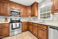 107 Fodder Drive, Hubert, NC 28539 — 3-bedroom home in Ole Mill Village, Hubert, NC, photo 17 of 59: 17_Kitchen_Range