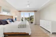 212 Old Causeway Road 107 & B13 Slip, Beaufort, NC 28516 — 3-bedroom waterfront condo in Morgan Creek Landing, Beaufort, NC, photo 6 of 49: Primary suite with water views
