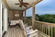 118 Shell Drive West, Emerald Isle, NC 28594 — 5-bedroom waterfront townhome, Emerald Isle, NC, photo 10 of 42: 118 Shell Dr. Main level balcony