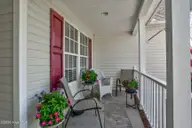 3578 Spring Mill Trail Road, Rocky Mount, NC 27804 — 3-bedroom home in Old Carriage Farm, Rocky Mount, NC, photo 2 of 35: Covered front Porch