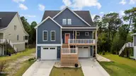 307 Cape Fear Loop, Emerald Isle, NC 28594 — 4-bedroom waterfront home in Cape Emerald, Emerald Isle, NC, photo 1 of 62: 307 Cape Fear Loop