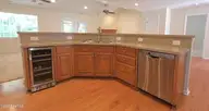 120 Hilda Drive, New Bern, NC 28562 — 4-bedroom home in Forest Run, New Bern, NC, photo 5 of 34: Beverage Fridge