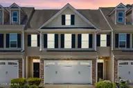 128 Wembley Drive, Clayton, NC 27527 — 3-bedroom townhome in Flowers Plantation, Clayton, NC, photo 1 of 22: hero twilight