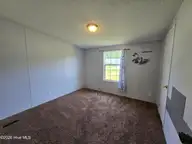 307 Kimberly Court, Elizabeth City, NC 27909 — 4-bedroom manufactured home in Horseshoe Acres, Elizabeth City, NC, photo 16 of 20: Bedroom 3