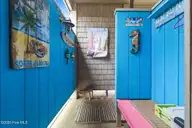 3 Myrtle Court, Ocean Isle Beach, NC 28469 — 4-bedroom home in Island Park, Ocean Isle Beach, NC, photo 10 of 55: Cool outdoor shower!