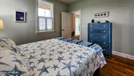 111 Blockade Runner Drive, Holden Beach, NC 28462 — 4-bedroom home, Holden Beach, NC, photo 6 of 54: Downstairs Guest Suite 1