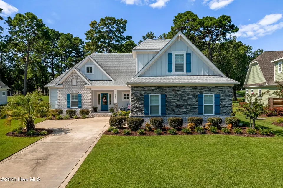 141 Clubhouse Road, Sunset Beach, NC 28468 — 4-bedroom home in Sea Trail Plantation, Sunset Beach, NC, photo 1 of 59: Front of House