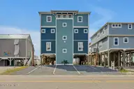 4005 E Beach Drive, Oak Island, NC 28465 — 7-bedroom waterfront home in E. Long Beach, Oak Island, NC, photo 1 of 65: Affinity 1