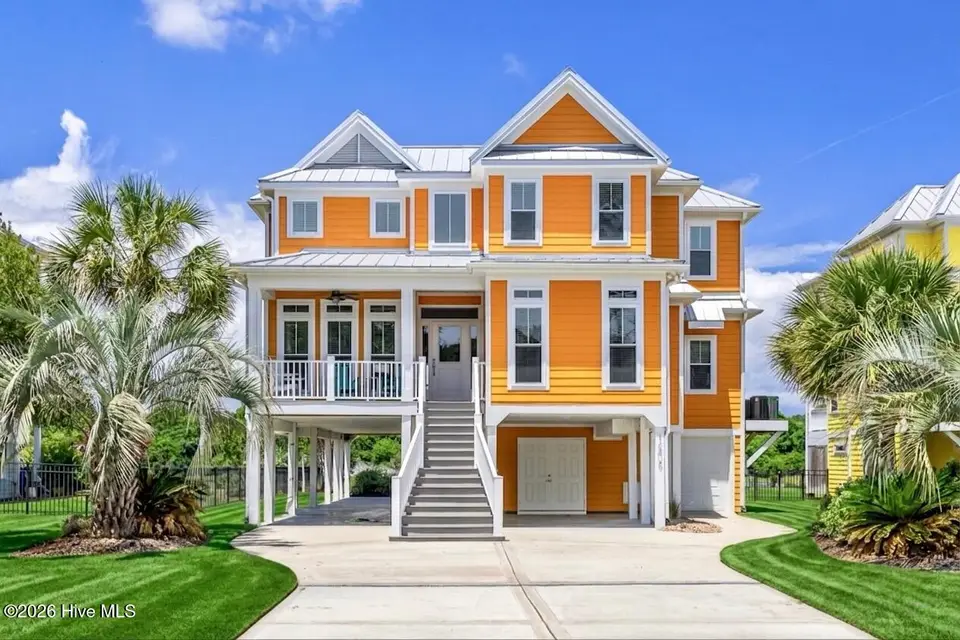 1606 E Yacht Drive, Oak Island, NC 28465 — 4-bedroom waterfront home in Tranquil Harbor, Oak Island, NC, photo 1 of 55