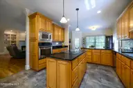1996 Hoods Creek Drive, New Bern, NC 28562 — 3-bedroom waterfront home, New Bern, NC, photo 3 of 70: Kitchen with Island & Breakfast Nook