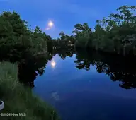 4221 Skeffington Court, Southport, NC 28461 — 3-bedroom waterfront home in St James, Southport, NC, photo 3 of 71: The Moon over YOUR Pond