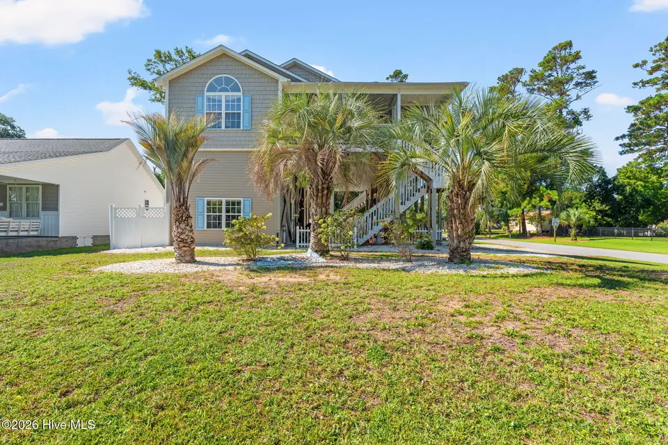 5801 E Yacht Drive, Oak Island, NC 28465 — 4-bedroom home in Tranquil Harbour Island, Oak Island, NC, photo 1 of 50