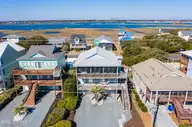 1131 S Shore Drive, Surf City, NC 28445 — 4-bedroom waterfront home in Horse Hammock, Surf City, NC, photo 2 of 40: DJI_0778p