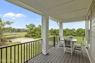 609 Cannonsgate Drive, Newport, NC 28570 — 4-bedroom waterfront home in Cannonsgate, Newport, NC, photo 11 of 41: Staged Porch with Creek Views