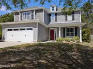 114 Lumis Court, Hampstead, NC 28443 — 4-bedroom home in Dogwood Lakes, Hampstead, NC, photo 1 of 26: PXL_20260331_173455563