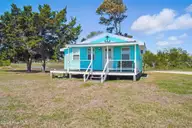 7663 Myrtle Grove Road, Wilmington, NC 28409 — 1-bedroom waterfront home in Egret Point, Wilmington, NC, photo 6 of 30: Front of Home