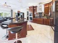 8900 Mahogany Run, Wilmington, NC 28411 — 3-bedroom home in Porters Neck Plantation, Wilmington, NC, photo 16 of 75: 26-web-or-mls-27_STILL075_kitchen-island