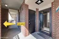 1505 Salter Path Road 435, Indian Beach, NC 28512 — 3-bedroom waterfront condo in Summer Winds Condominiums, Indian Beach, NC, photo 4 of 28: 1505SalterPathRoadUnit435-ELEVATORARROW
