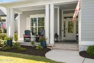 3841 White Birch Way, Southport, NC 28461 — 3-bedroom waterfront home in St James, Southport, NC, photo 12 of 73: Rocking Chair Front Porch
