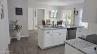 108 Willowbend Drive, Burgaw, NC 28425 — 3-bedroom home in Tealbriar, Burgaw, NC, photo 11 of 27: Open concept with Island and Dining room