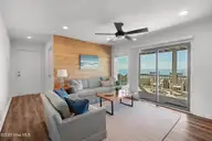 1819 Salter Path Road, Indian Beach, NC 28512 — 5-bedroom waterfront home in Roosevelt Estate, Indian Beach, NC, photo 9 of 58: Ground floor den w/ water views