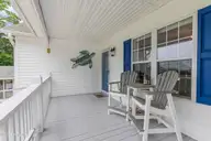 1803 W Yacht Drive, Oak Island, NC 28465 — 3-bedroom home in Pinners Point, Oak Island, NC, photo 4 of 39: Front Porch