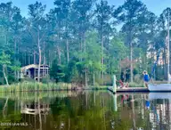 931 Schrams Beach Road, Belhaven, NC 27810 — 2-bedroom waterfront home in Windtide, Belhaven, NC, photo 15 of 67: photo 02