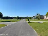 104 41 Anchorage Drive, Havelock, NC 28532 — lot in Moorings, Havelock, NC, photo 4 of 15: View down street from lot