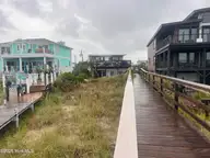 832 Fort Fisher Boulevard N, Kure Beach, NC 28449 — 4-bedroom waterfront home in Hanby Beach, Kure Beach, NC, photo 2 of 5: House from Private Beach Access