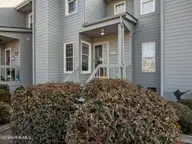 8713 Plantation Drive 402, Emerald Isle, NC 28594 — 3-bedroom waterfront townhome in Emerald Plantation, Emerald Isle, NC, photo 1 of 68: Front