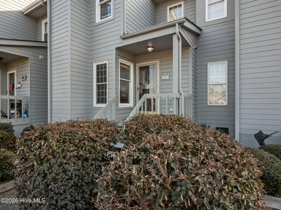 8713 Plantation Drive 402, Emerald Isle, NC 28594 — 3-bedroom waterfront townhome in Emerald Plantation, Emerald Isle, NC, photo 1 of 68: Front