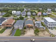 210 W Beach Drive, Oak Island, NC 28465 — 4-bedroom waterfront home, Oak Island, NC, photo 10 of 42: 12-web-or-mls-DJI_20250614140341_0278_D