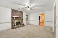 1120 Par Three Drive S, Wilson, NC 27893 — 3-bedroom home in Willow Springs, Wilson, NC, photo 16 of 50: Den
