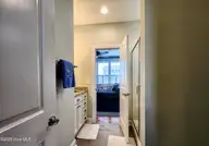 111 Blockade Runner Drive, Holden Beach, NC 28462 — 4-bedroom home, Holden Beach, NC, photo 14 of 54: Downstairs Full Bathroom