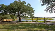 3015 Tasso Drive SW Lot 10- Greenbriar C, Sunset Beach, NC 28468 — 3-bedroom home in Southshore Bay, Sunset Beach, NC, photo 20 of 22: Calabash Lakes Area-21