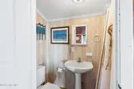 4025 E Beach Drive, Oak Island, NC 28465 — 3-bedroom waterfront home in Long Beach, Oak Island, NC, photo 24 of 40: 40-web-or-mls-CAMMediaLLC.com (40 of 47)
