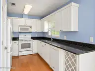 121 NE 6th Street, Oak Island, NC 28465 — 3-bedroom home in Tranquil Harbor, Oak Island, NC, photo 6 of 21: Kitchen View