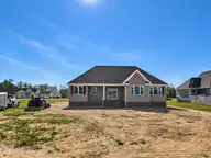 462 Pointe Vista Drive, Elizabeth City, NC 27909 — 3-bedroom waterfront home in The Waters At Sunset Pointe, Elizabeth City, NC, photo 17 of 19: Back