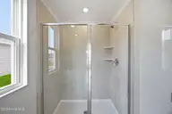 7483 Julius Drive NE 60, Leland, NC 28451 — 3-bedroom home in Coastal Haven, Leland, NC, photo 12 of 28: Primary Shower