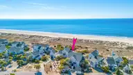 811 S Bald Head Wynd # B, Bald Head Island, NC 28461 — 3-bedroom waterfront townhome in BHI Stage I & II Flora's Bluff, Bald Head Island, NC, photo 12 of 54: DJI_20260217110903_0012_D-Edit