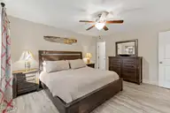 117 NE 19th Street, Oak Island, NC 28465 — 3-bedroom home in Tranquil Harbor, Oak Island, NC, photo 20 of 77: Primary Bedroom