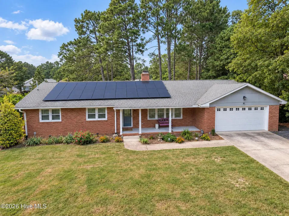 22 Pine Lake Drive, Whispering Pines, NC 28327 — 3-bedroom waterfront home in Pine Lakes, Whispering Pines, NC, photo 1 of 53: Lakefront Living in Whispering Pines